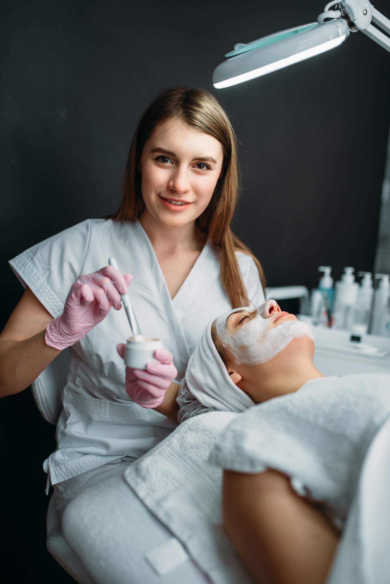 Female Doctor Holds Cream And Brush In Hands.jpg